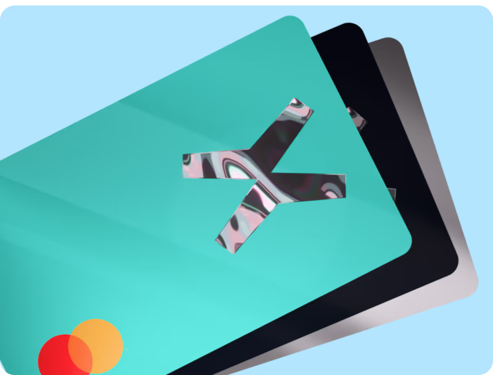 The image features three credit or debit cards stacked on top of each other. The cards have a minimalist design with varying colors: a teal-colored card with a reflective "X" logo in the center, a black card, and a silver card. The bottom left corner of the teal card has the Mastercard logo in orange and red. The background is light blue, and the cards have a sleek, modern appearance.